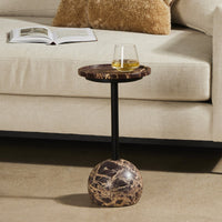 Close-up of the Wren Accent Table featuring a round marble top and a sleek black metal base.