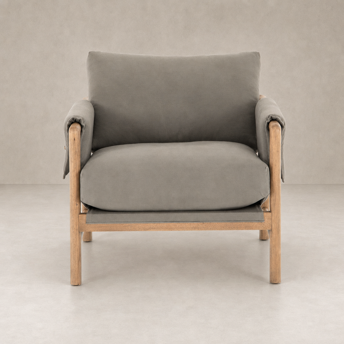 Mykonos Chair in Villa Olive with soft cushions and natural wood frame.