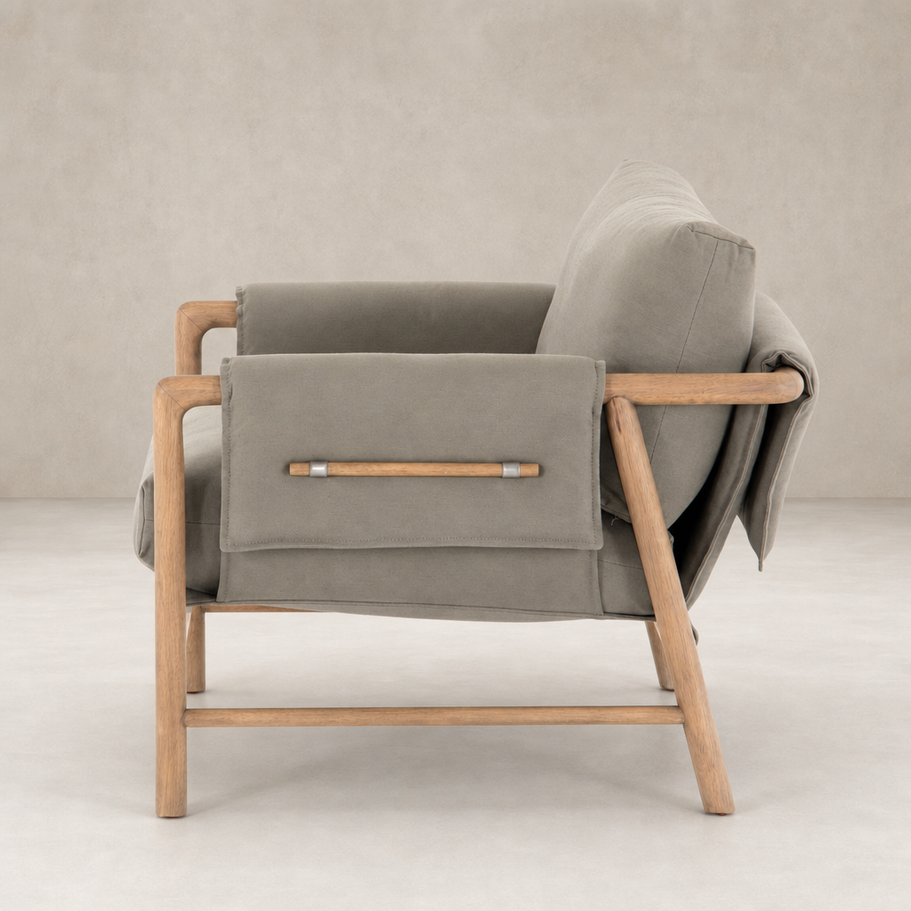 Mykonos Chair in Villa Olive featuring a sleek wooden frame and plush upholstery.