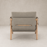 Mykonos Chair in Villa Olive featuring a sleek design and natural wood accents.