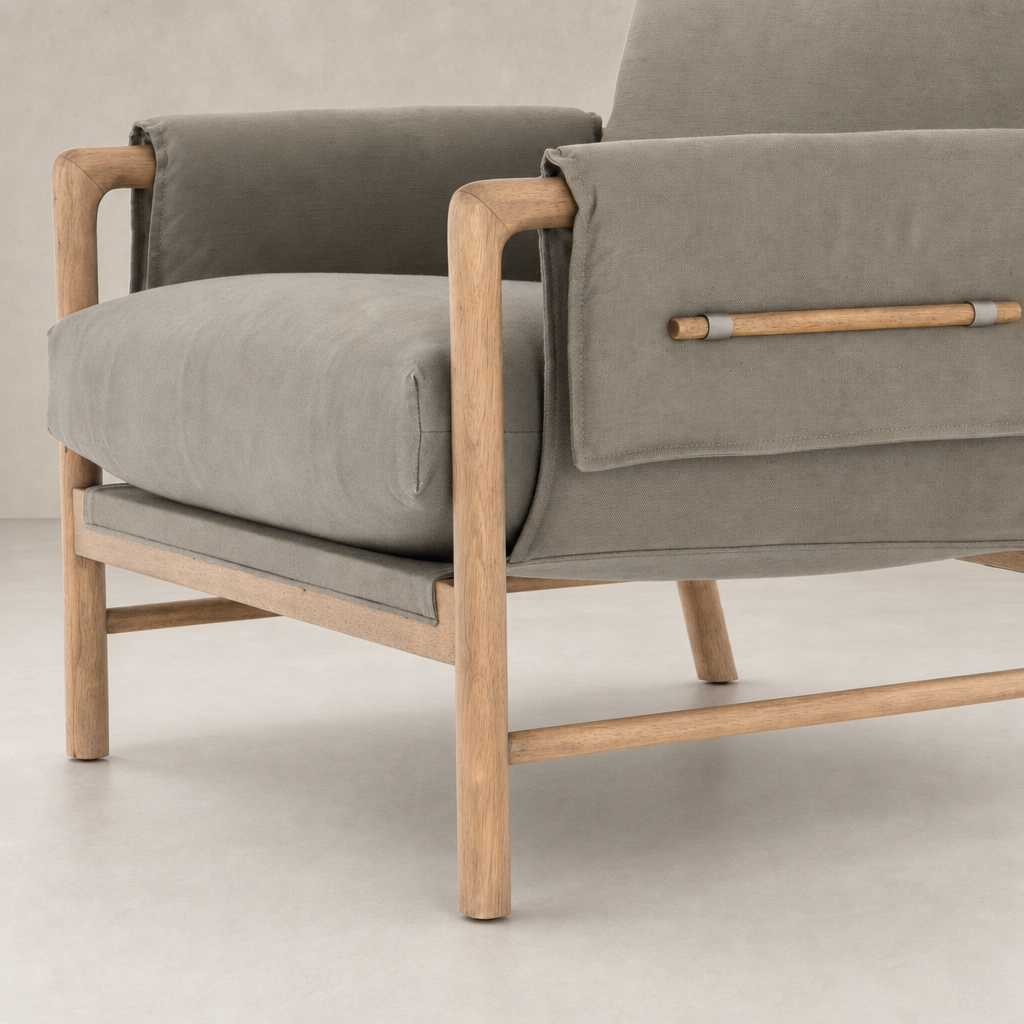 Mykonos Chair in Villa Olive features soft cushions and natural wooden accents.