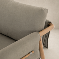 Mykonos Chair in Villa Olive with soft cushioning and wooden armrests.