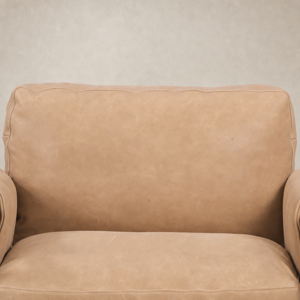 Mykonos Chair in Palermo Nude featuring soft, textured upholstery and comfortable armrests.