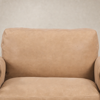Mykonos Chair in Palermo Nude featuring soft, textured upholstery and comfortable armrests.
