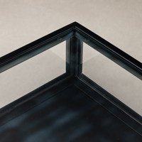 Close-up of the sleek black corner detail of the Kestrel Box Executive Desk.