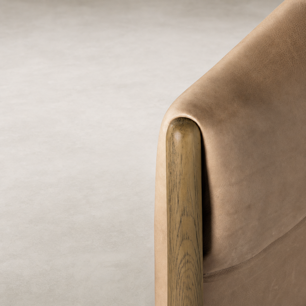 Remington Chair in Palermo Nude showing smooth leather and elegant wooden armrest.