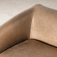 Close-up of Remington Chair in Palermo Nude showcasing textured leather upholstery.