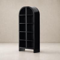 Curved black Delta Cabinet with glass shelves, featuring brass accents and a sleek design.