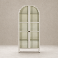 Cream powder coat Delta Cabinet with arched top and glass shelves.