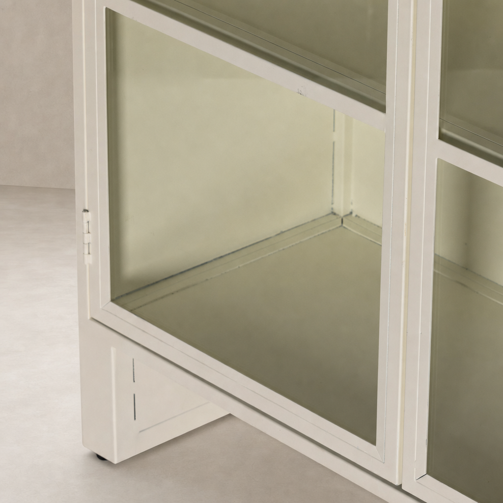 Cream powder coat Delta Cabinet with glass doors and sleek, modern design.