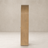 Priya Cabinet in burnished Mindi showcasing smooth, curved edges and an elegant finish.
