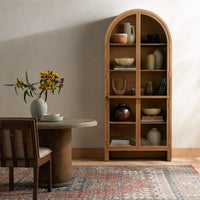 Stylish Priya Cabinet in burnished Mindi wood, featuring arched top and open shelves.
