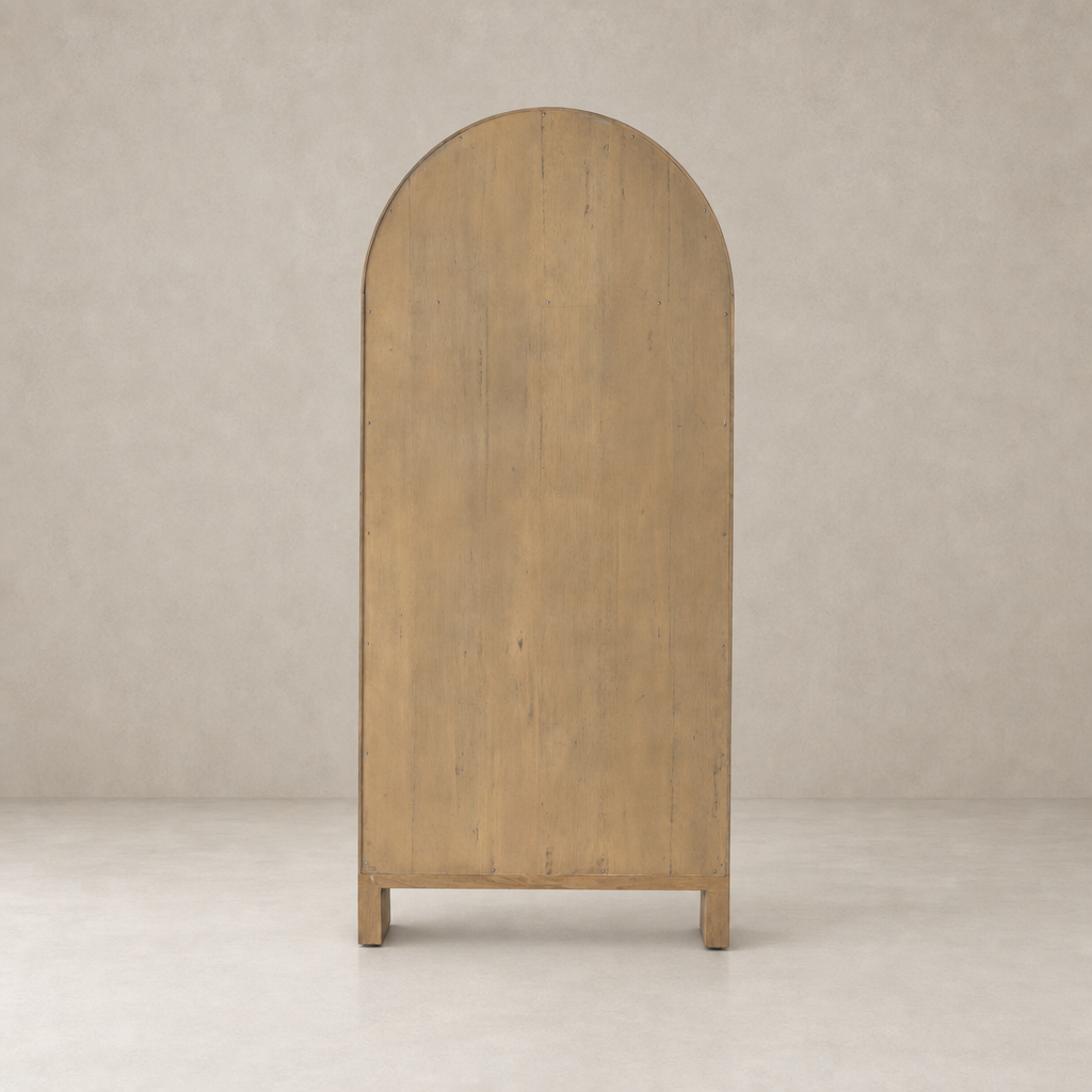 Priya Cabinet in burnished Mindi wood featuring a rounded top and sturdy legs.