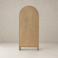 Priya Cabinet in burnished Mindi wood featuring a rounded top and sturdy legs.