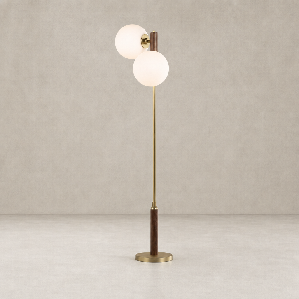 Aged brass floor lamp with two frosted globe shades and wooden base.