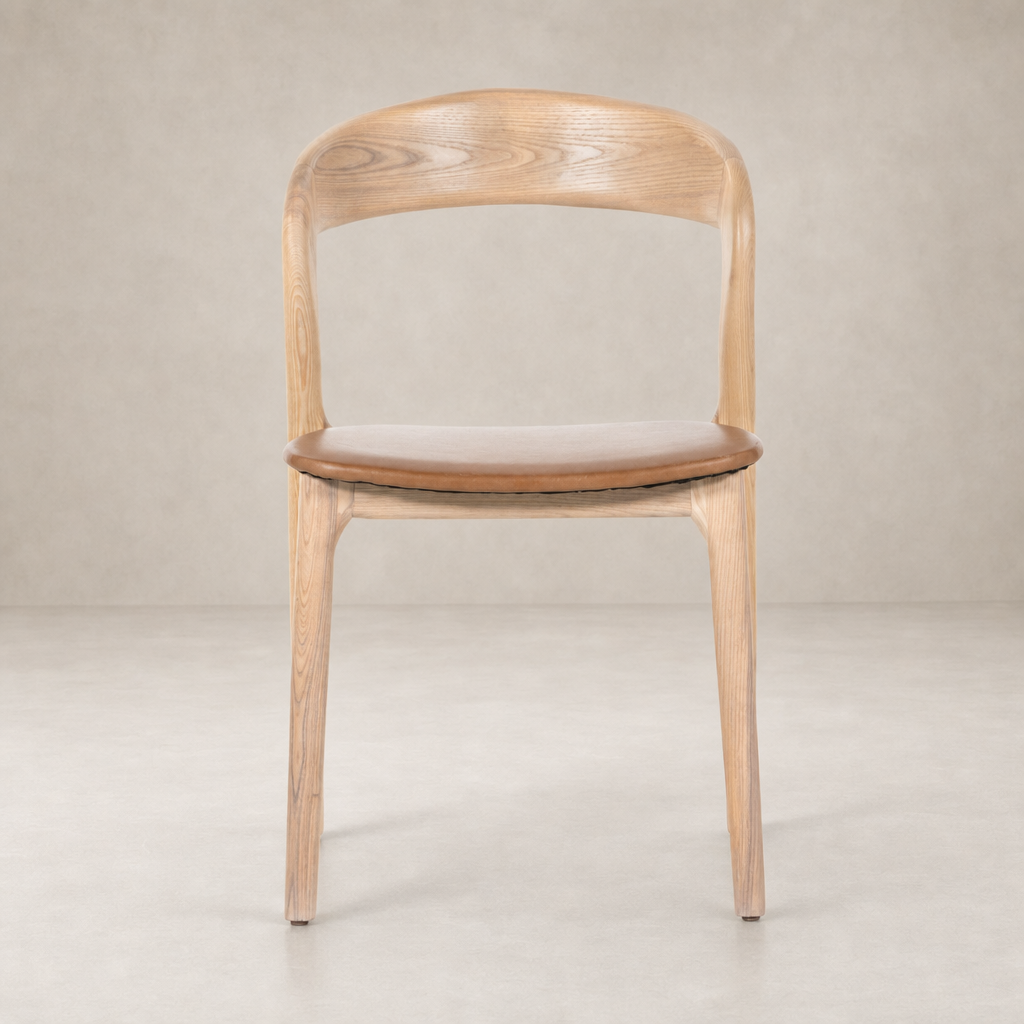Amato Dining Chair in Sonoma Butterscotch with a curved wooden back and cushioned seat.