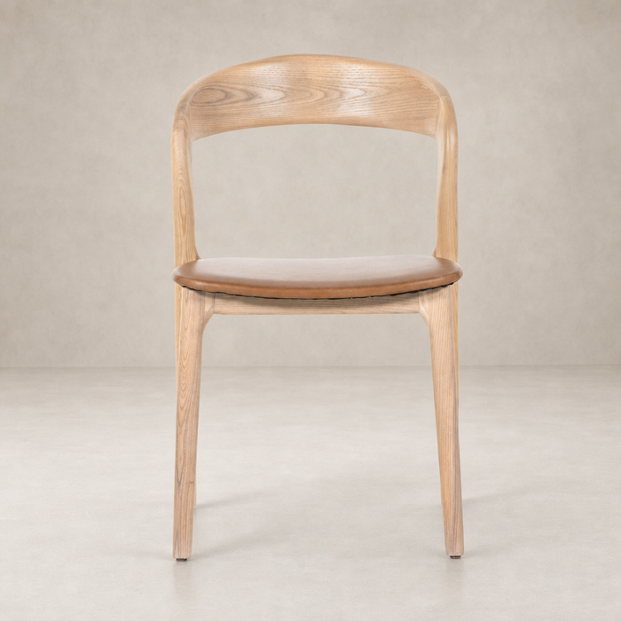 Amato Dining Chair in Sonoma Butterscotch with a curved wooden back and cushioned seat.
