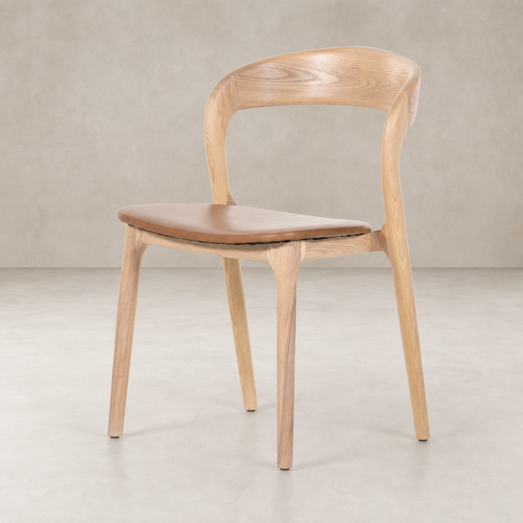 Amato Dining Chair in Sonoma Butterscotch with curved wooden back and smooth seat.