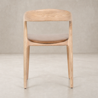 Amato Dining Chair in Sonoma Butterscotch with a gentle curve and sleek wooden design.