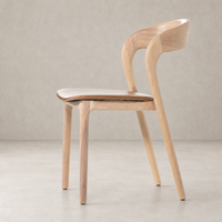 Amato Dining Chair in Sonoma Butterscotch showcases sleek curves and a natural wood finish.