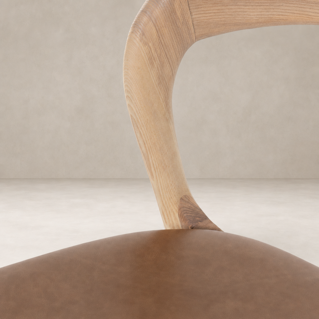 Amato Dining Chair features a Sonoma Butterscotch leather seat and a curved wooden backrest.