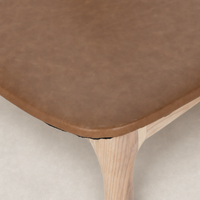 Close-up of the Amato Dining Chair in Sonoma Butterscotch showcasing its smooth faux leather texture.