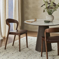 Amato Dining Chair in Sonoma Coco displayed beside a round dining table.