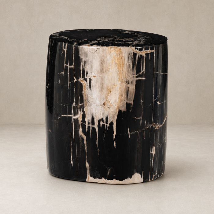 Naxos End Table features a striking black and gold marbled finish with a sleek cylindrical shape.