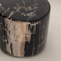 Naxos End Table features a sleek rounded shape with intricate wood grain patterns.