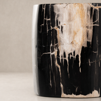 Naxos End Table features a sleek black and white marble finish with elegant veining.