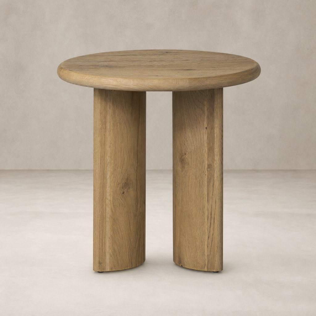 Alden End Table with round top and sturdy wooden legs in a natural finish.