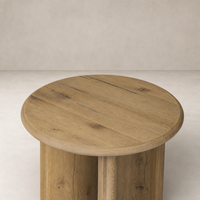 Alden End Table featuring a round top with a natural wood finish.