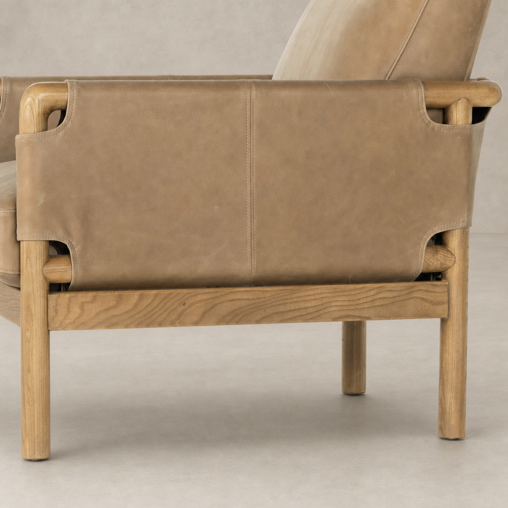 Soleil Chair in Palermo Drift features a sleek design with smooth leather and stylish wood legs.