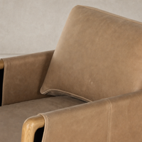 Soleil Chair in Palermo Drift features soft leather with wooden details and contemporary design.
