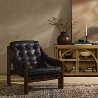 Langston Chair in heirloom black with tufted leather upholstery and wooden frame.