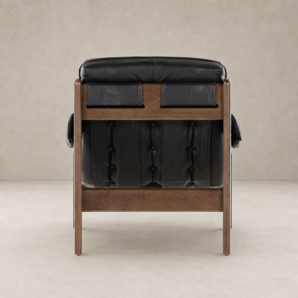 Langston Chair in Heirloom Black with tufted backrest and wood frame.