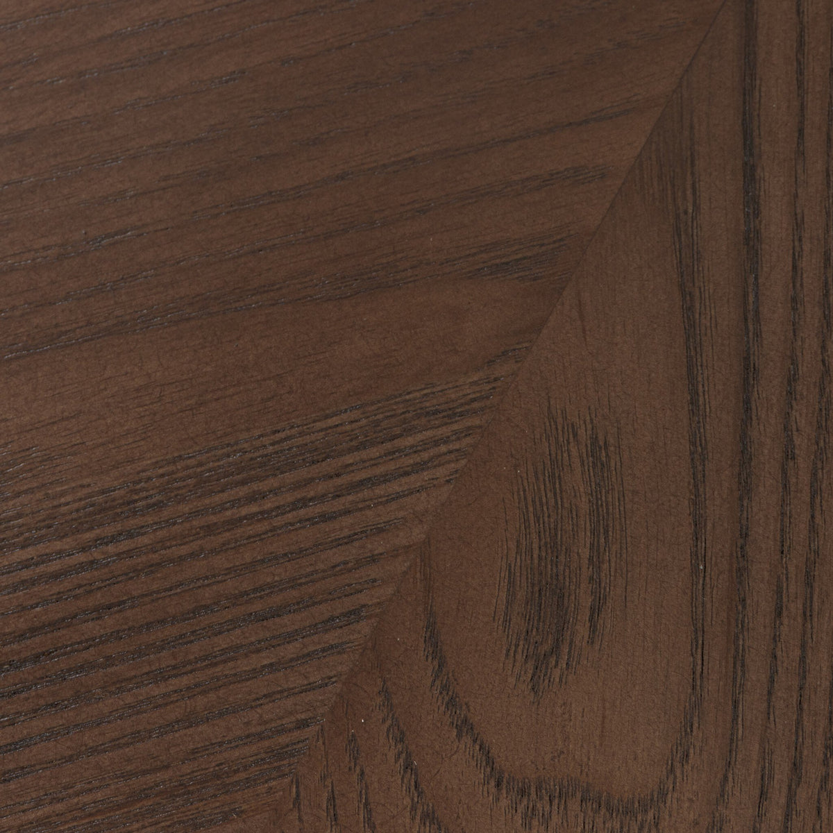 Heirloom Black wood close-up showcasing Langston Chair's rich texture and grain.