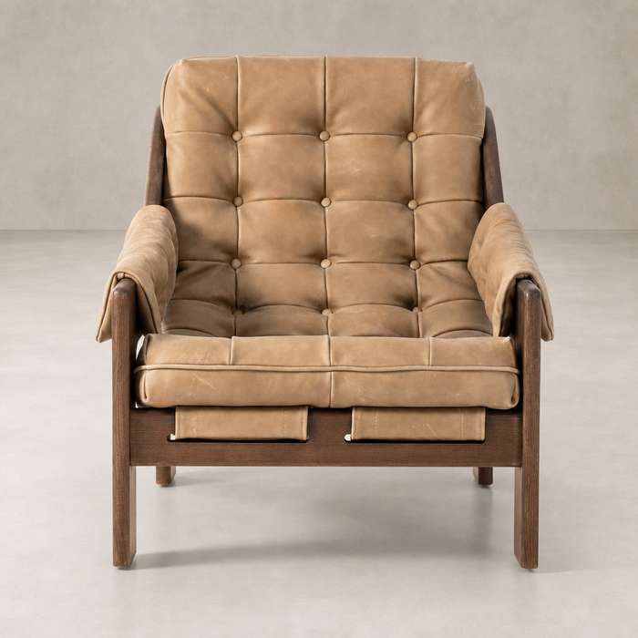 Langston Chair in Palermo Drift featuring a tufted leather seat and wood frame.