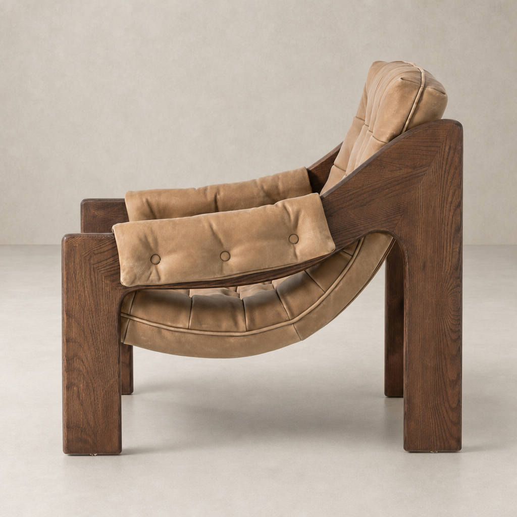 Langston Chair in Palermo Drift features a unique, curved wood frame and plush leather upholstery.