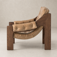 Langston Chair in Palermo Drift features a unique, curved wood frame and plush leather upholstery.