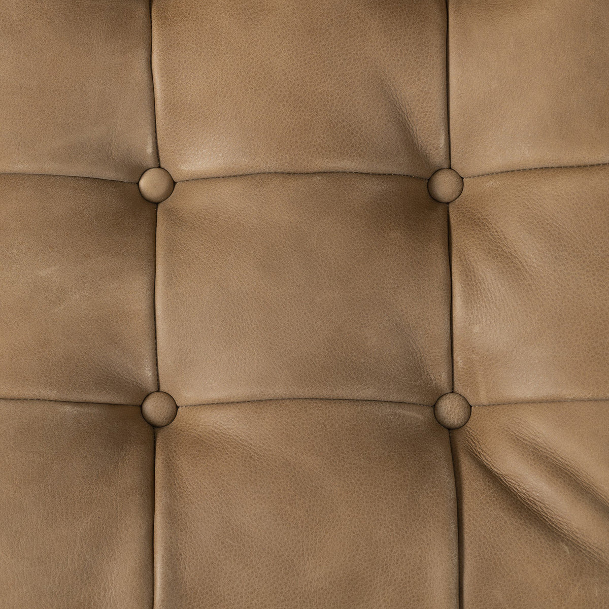 Detailed close-up of the Palermo Drift leather upholstery on the Langston Chair.