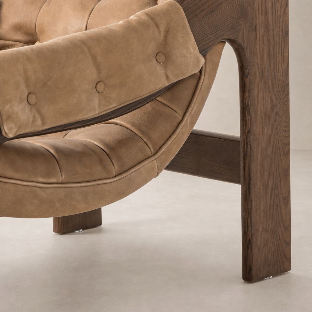 Langston Chair in Palermo Drift featuring a curved, comfortable design with tufted upholstery.