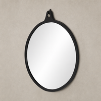 Knox Round Mirror in black aluminum with a sleek, minimalist design.
