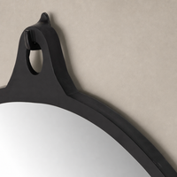 Knox Round Mirror featuring a black aluminum frame with unique top loop detail.
