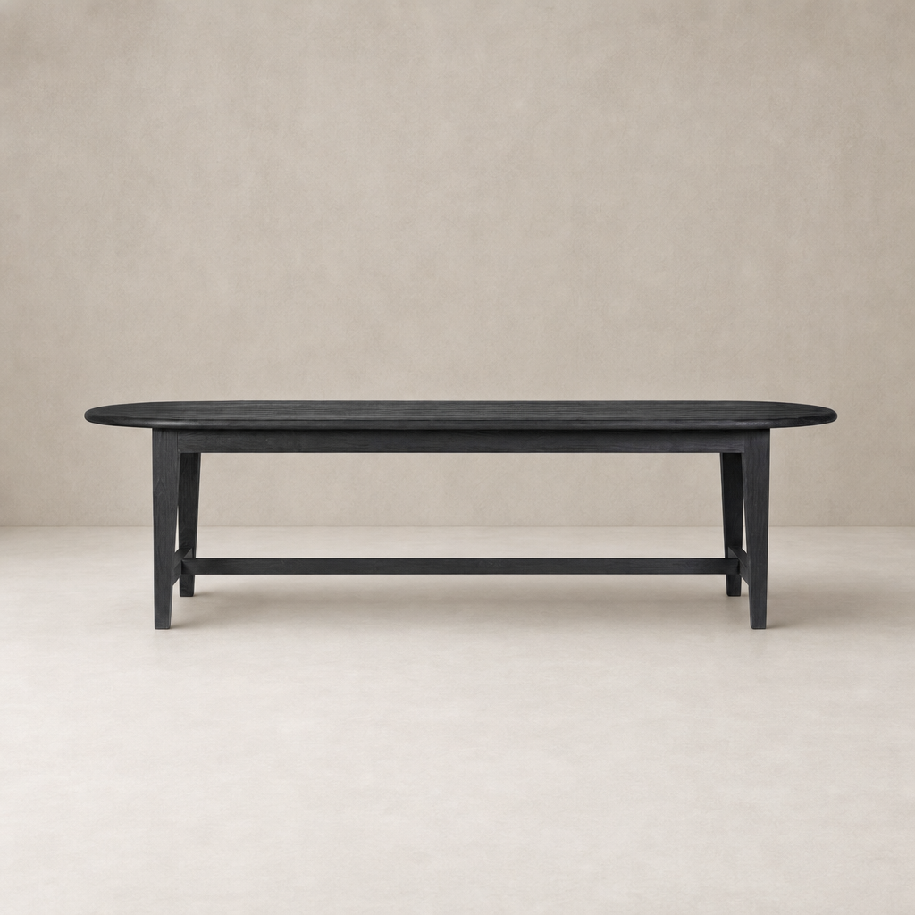 Savona Dining Table in black pine with a smooth, oval top and sturdy legs.