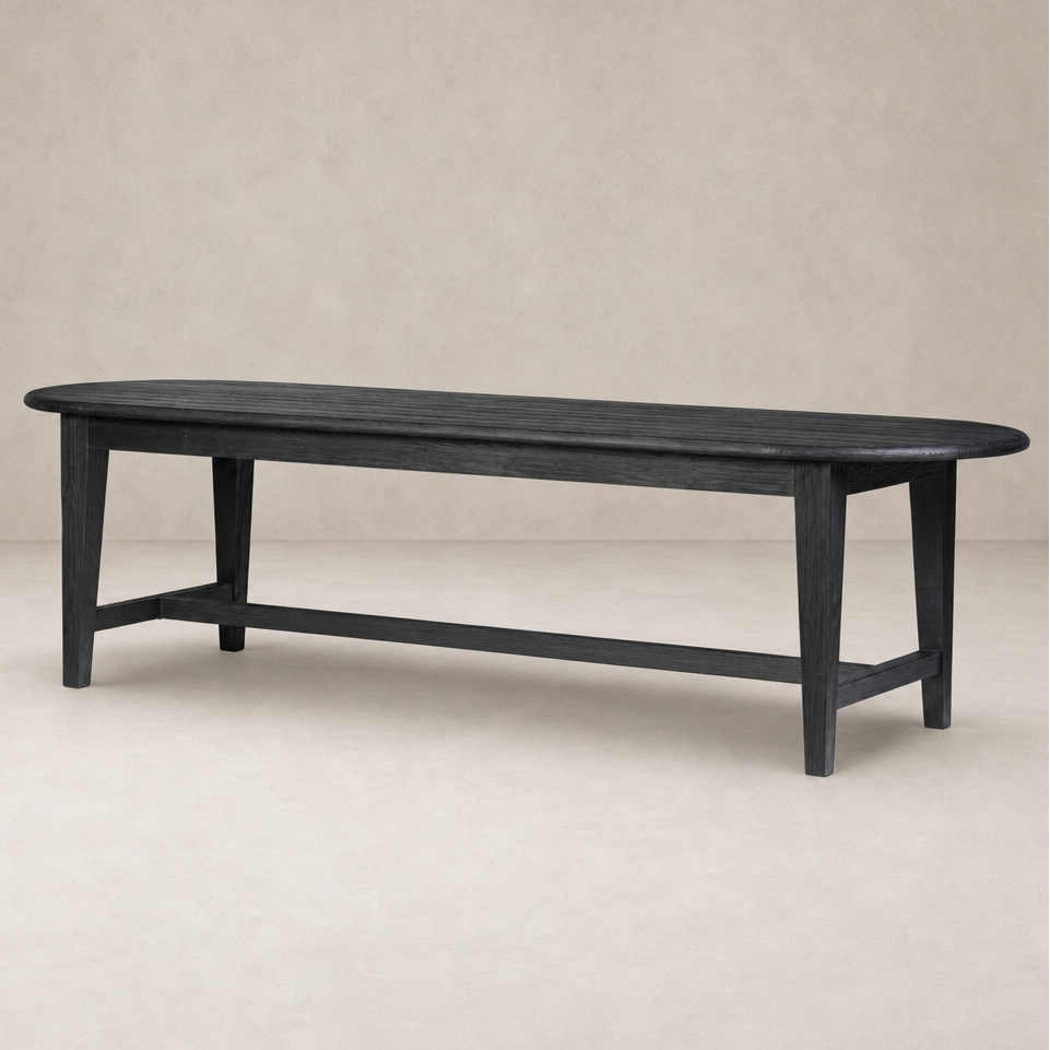 Savona Dining Table in Black Pine with a sleek oval shape and sturdy legs.