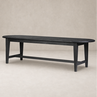 Savona Dining Table in Black Pine with a sleek oval shape and sturdy legs.