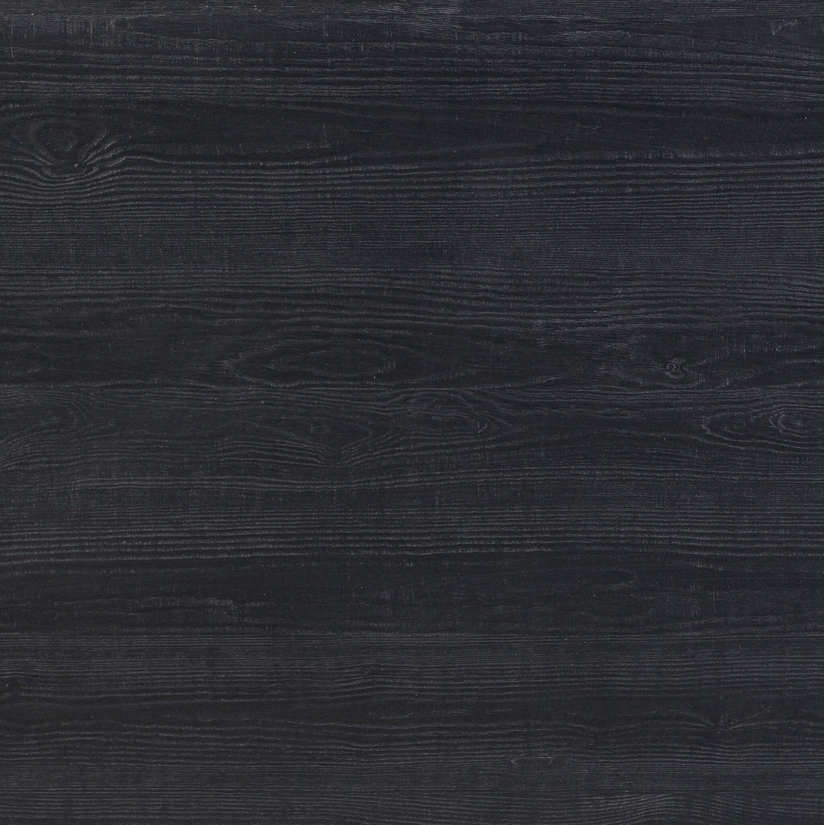 Close-up of the textured surface of the Savona Dining Table in Black Pine.