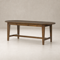 Savona Dining Table in waxed pine with an oval shape and sturdy legs.