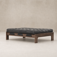 Hudson Cocktail Ottoman in Heirloom Black with tufted leather and wooden base.